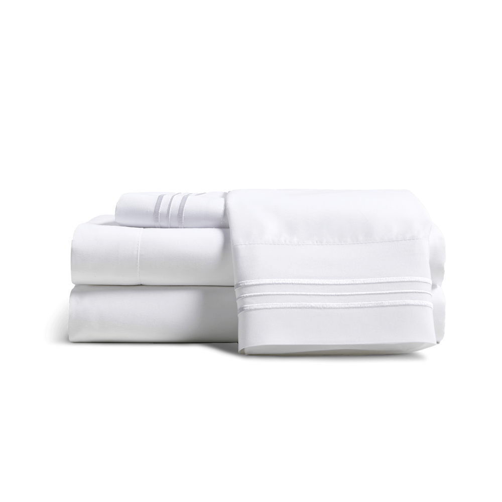 Cosy House Collection’s Everyday Bed sheets and pillowcases stacked together.